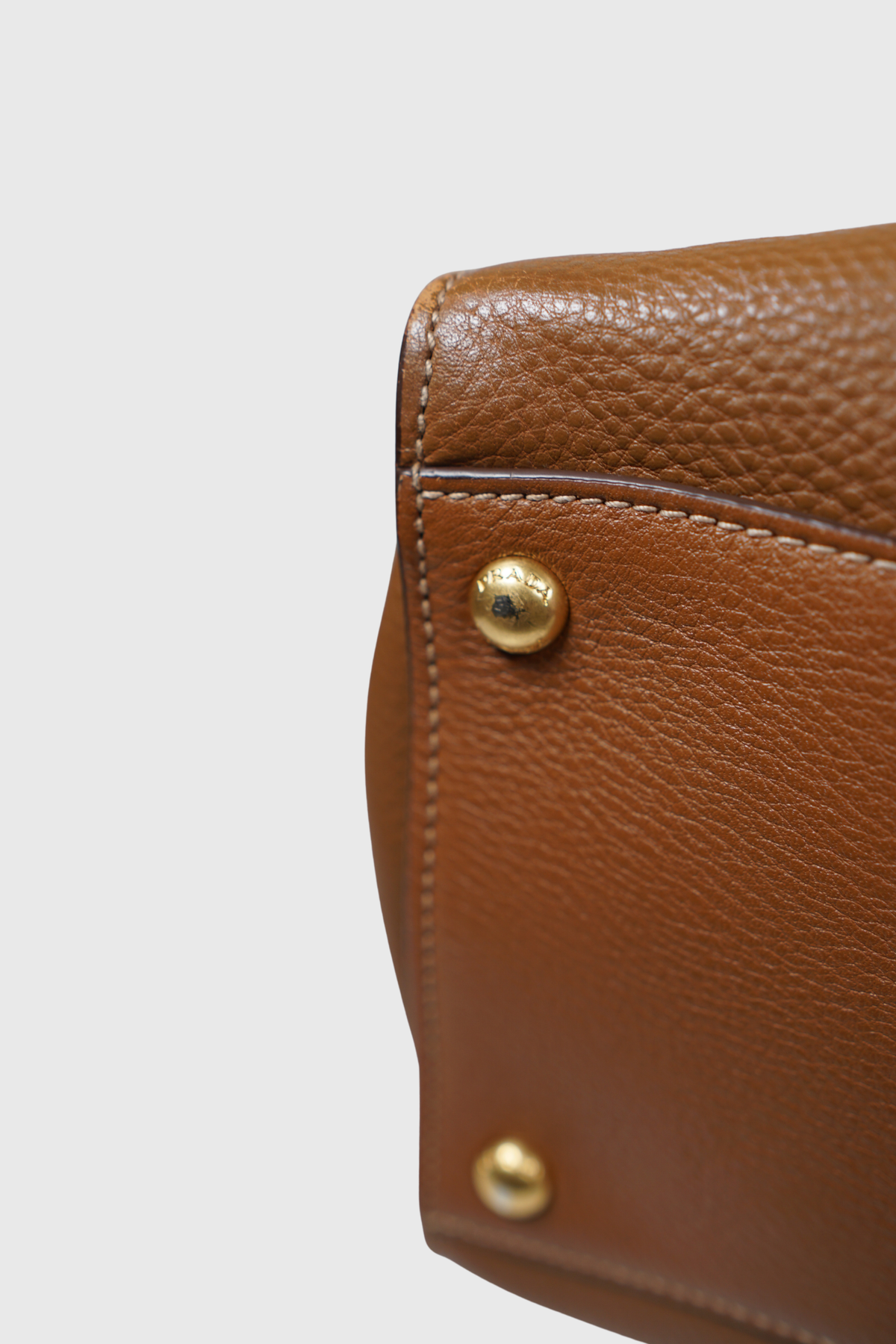 PRADA Vitello Daino Sound Lock brandy